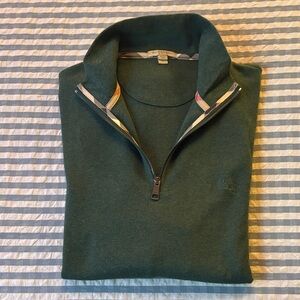 Burberry Dark Green Zip-Up Sweater, Size XL
Made in Peru.100% cotton. Chest logo